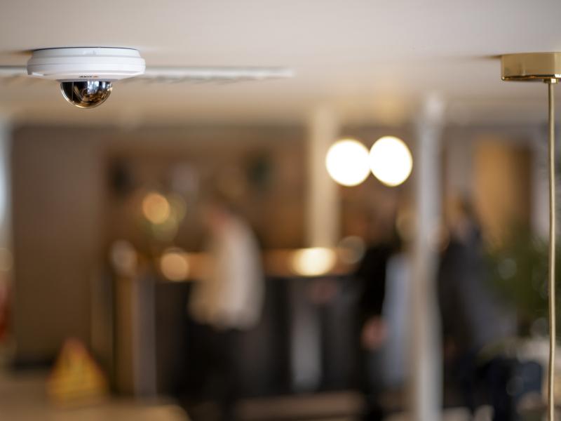 small ptz camera in ceiling of a hotel lobby