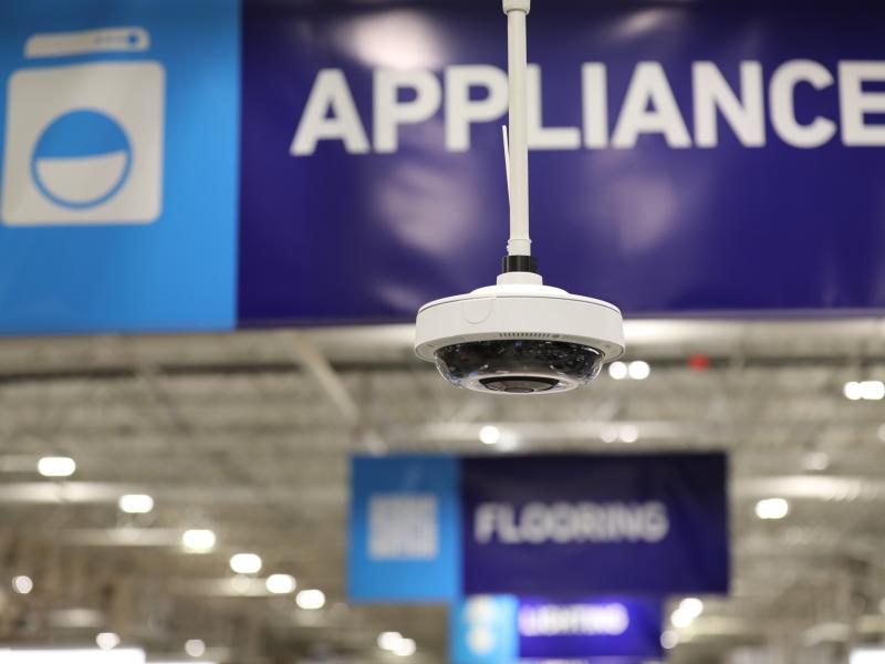 Camera hanging in Lowe's with Appliance sign in background