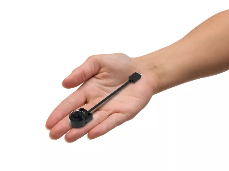 AXIS F1004 pinhole mount in hand from left