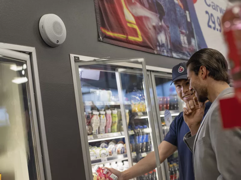 clerk helping customer fridge