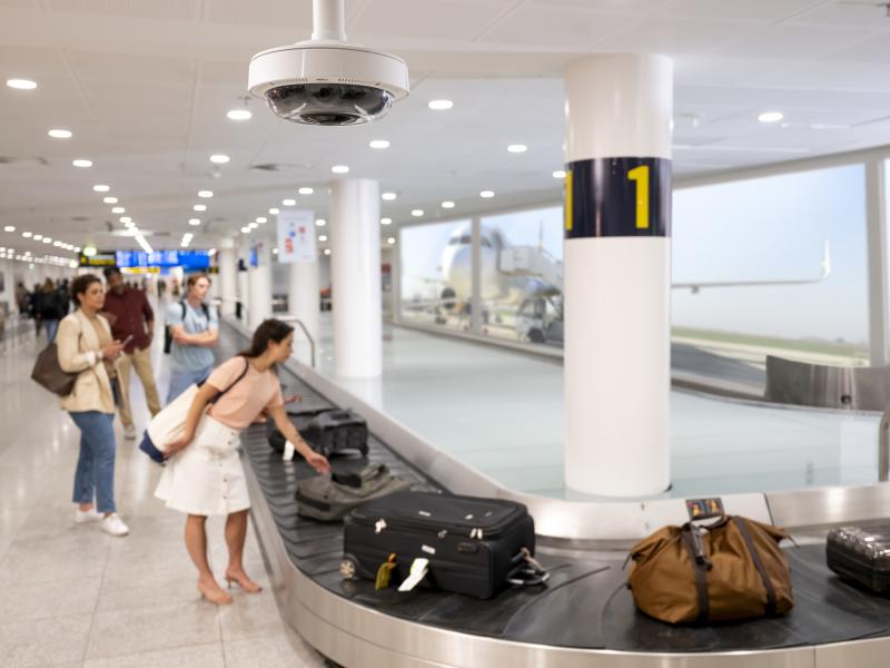 Airport security operations at luggage belt in arrival hall