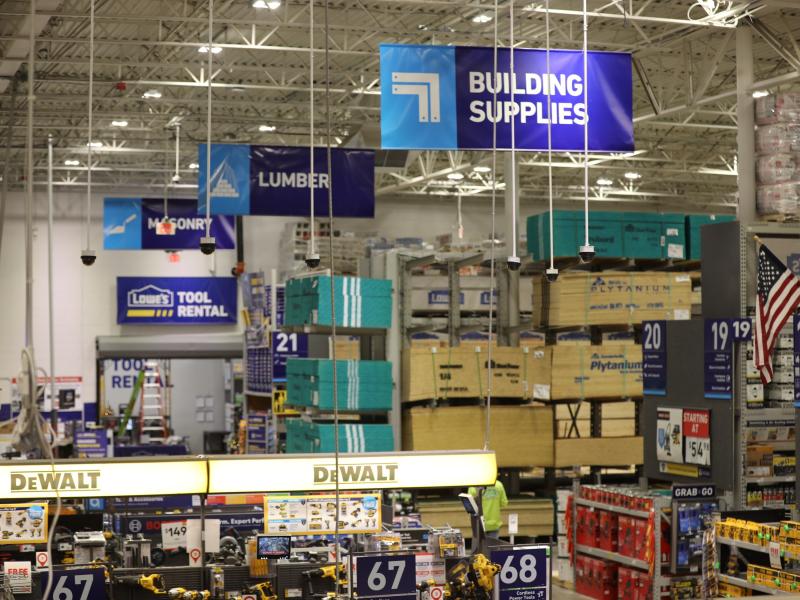Wide ceiling shot of Lowe's with cameras and signage