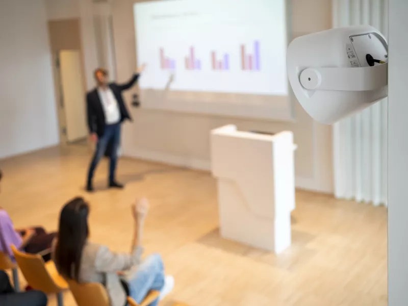 AXIS C1110-E on wall in lecturehall