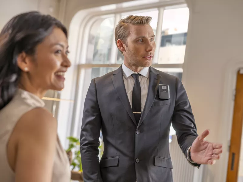 security guard and female staff in retail store