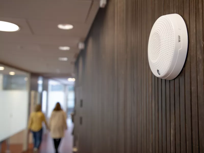 network mini speaker on wall in a narrow corridor