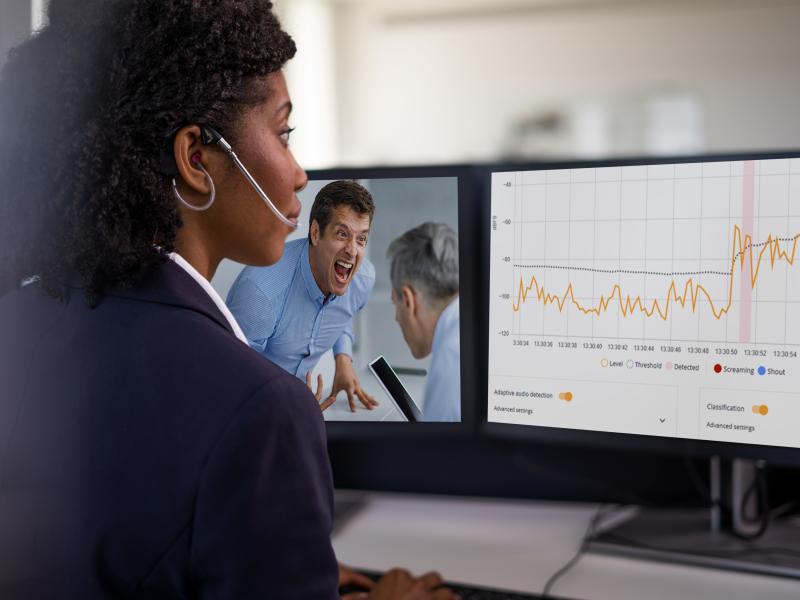 business woman monitoring two screens