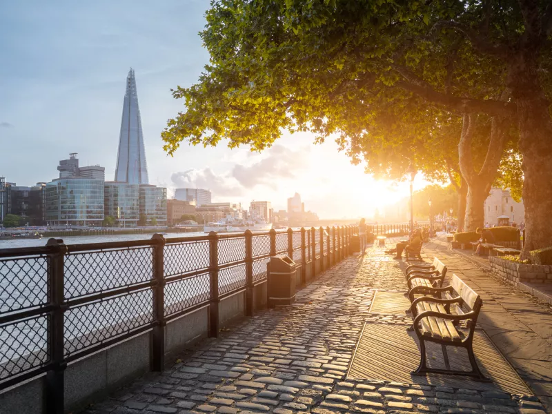 London skyline by Thames river in sunrise