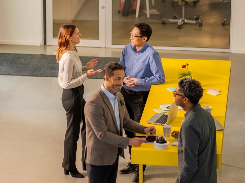 CPP group discussing by high desk