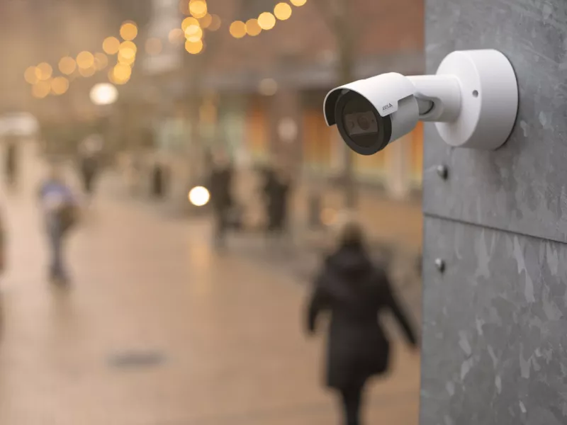 AXIS M20 mounted on wall with blurred background