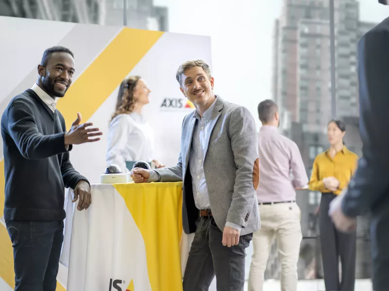 TIP men inviting to booth at event