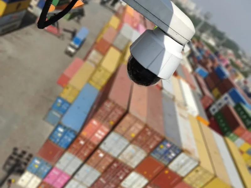 Camera showing cargo in background at logistics facility