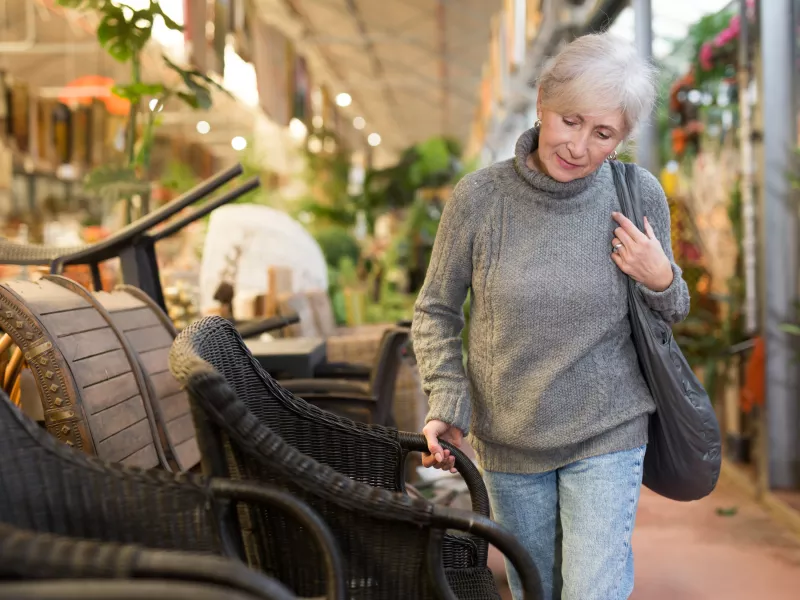 Woman shopping for a backyard chair