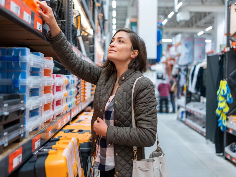 Woman reaching for home improvement tools