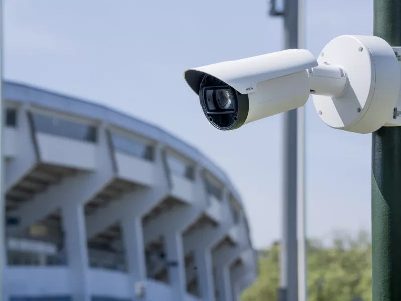 Camera looking left with sports arena in background