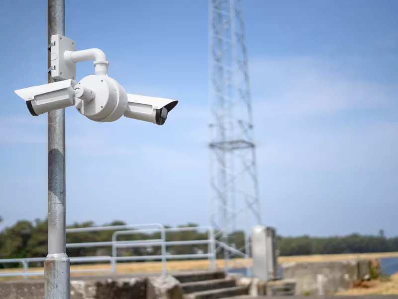 Two bullet cameras mounted on dual mount on a pole