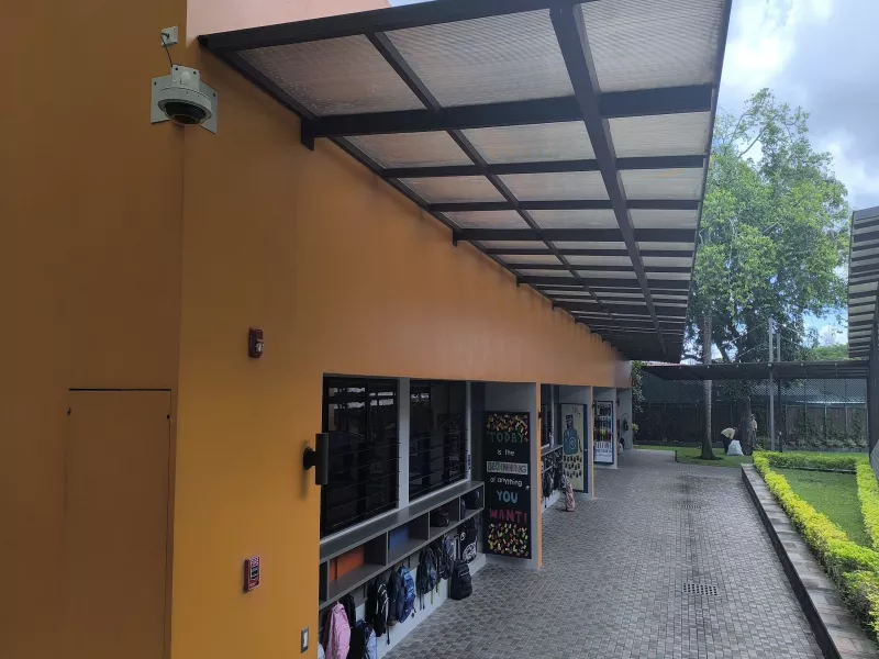 Camera shown on exterior wall of El Salvador school