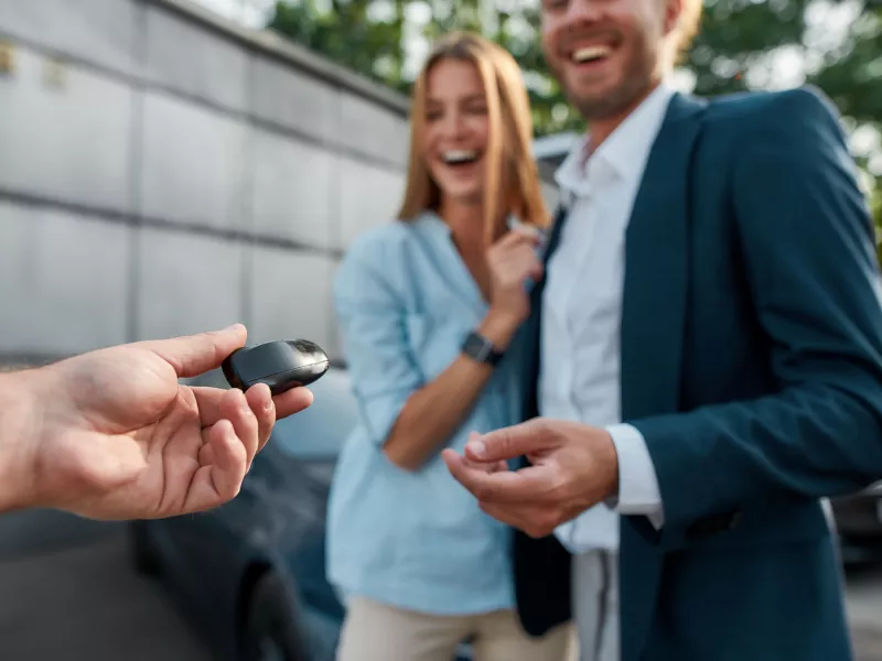 Happy couple get car key