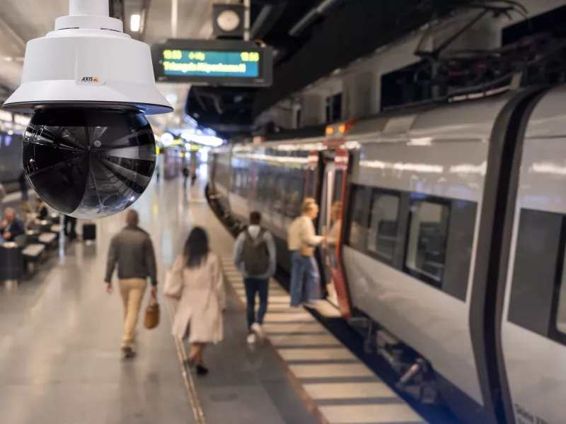 Train station platform with people entering the train