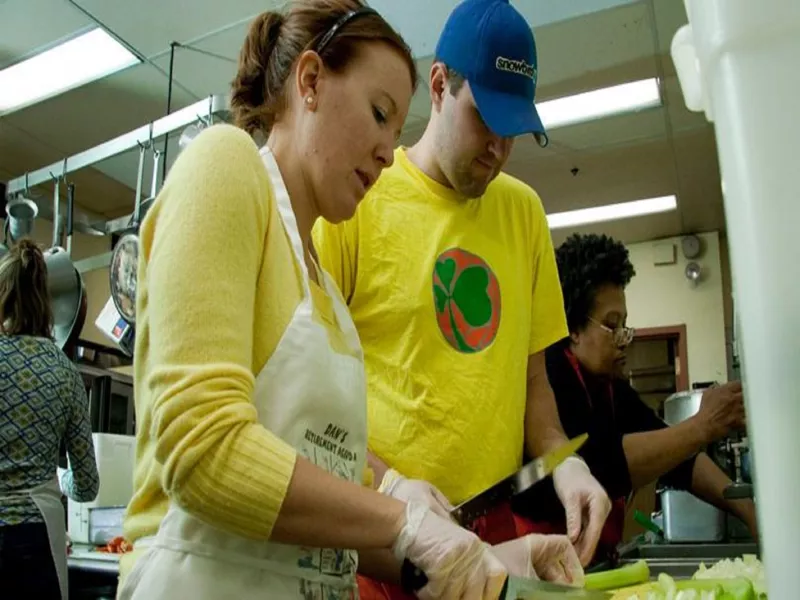 Two people prepping food at My Brother's Table