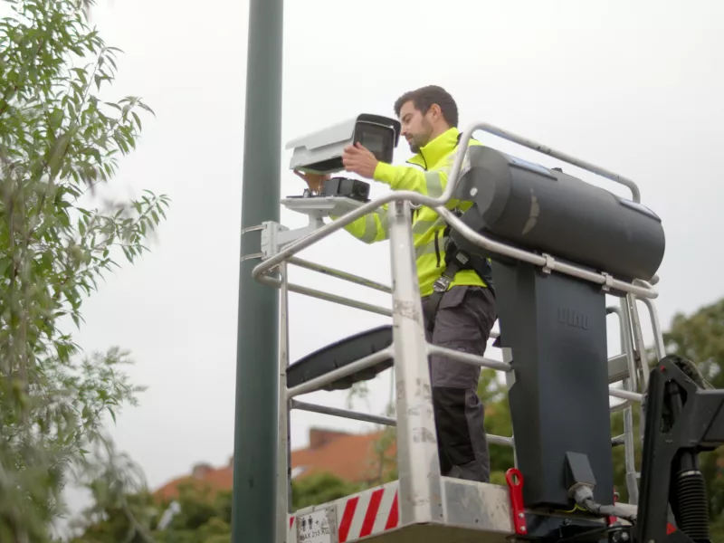 Installer installing a camera 