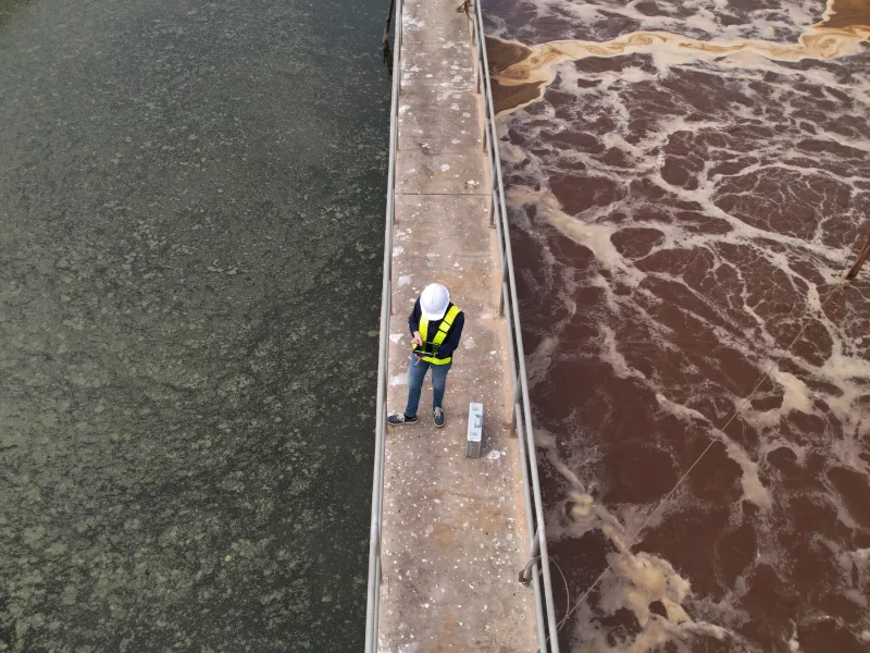 Water treatment plant staff on water bridge
