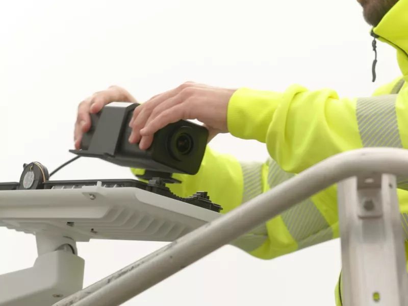 Camera being installed into outdoor housing