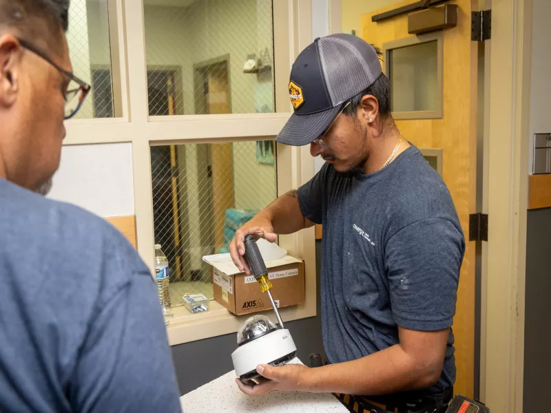 Worker preparing Axis dome for installation