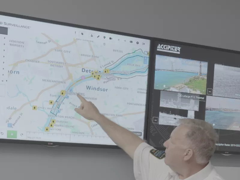 Harbor master looking at radar and camera displays