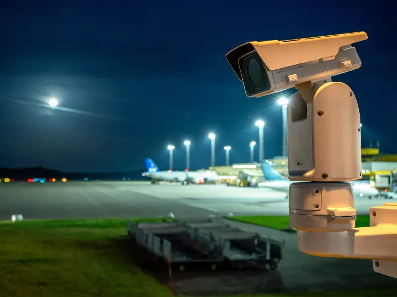 AXIS Q2111-E mounted on positioning unit at night at airport