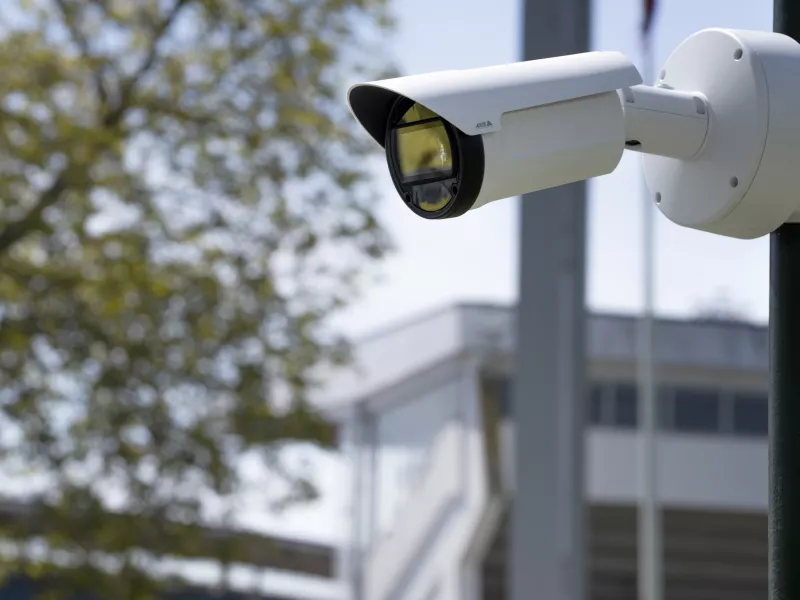 Bullet camera mounted on pole with blurred background