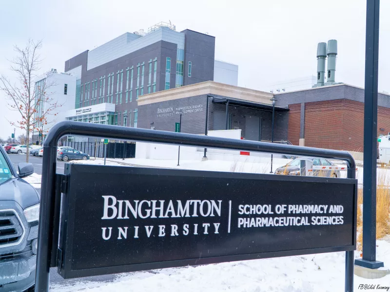 Exterior of a building at Binghamton University with sign