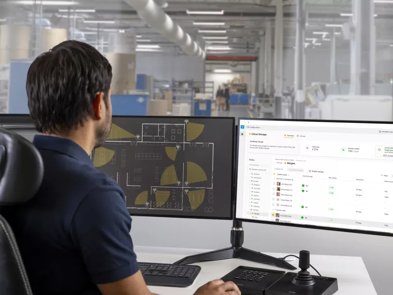 Man looking at interface of AXIS Camera Station cloud storage