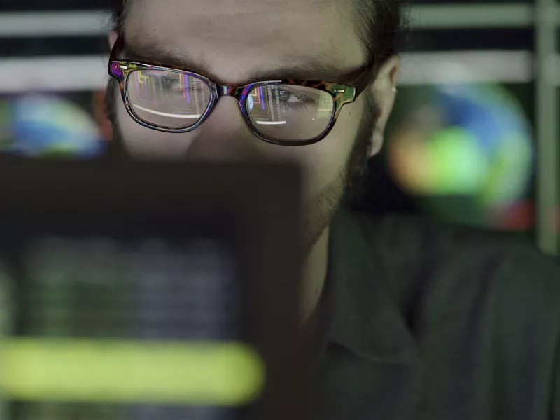 Man sitting in front of a monitor