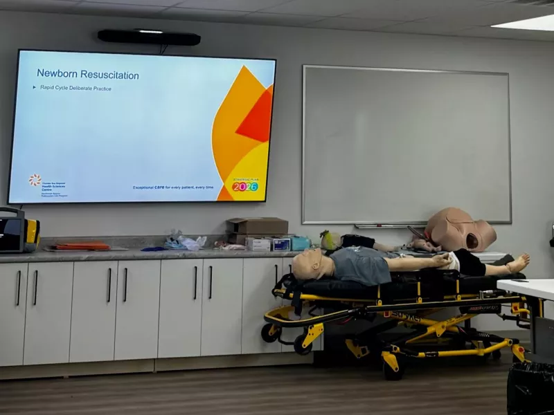 Display screen with mannequin on strecher