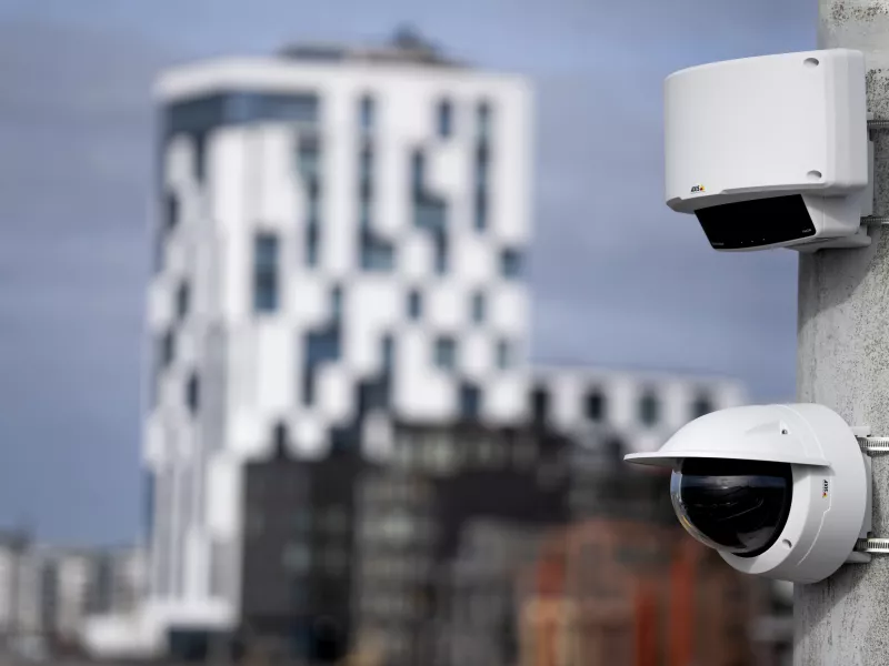 Dome camera and radar mounted on pole with blurred background