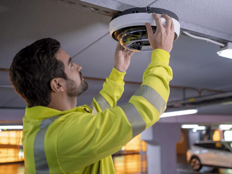 Man installing Axis camera