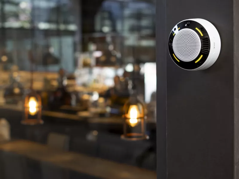 Air quality sensor mounted by a café.