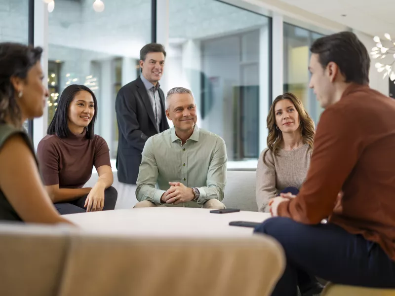 Partner groups sitting and discussing with each other.