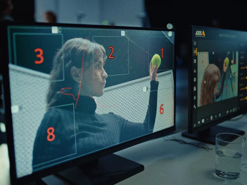 View of two desktop screens, both displaying an image of a girl holding a tennis ball.