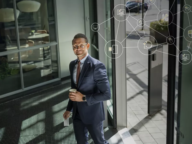 Man entering door being monitored.