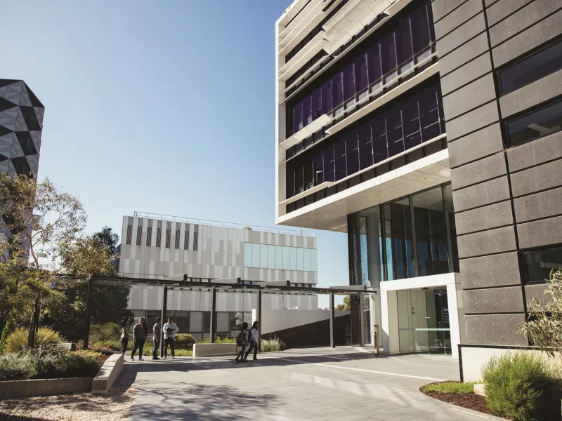 outside a university building in the middle of the day 