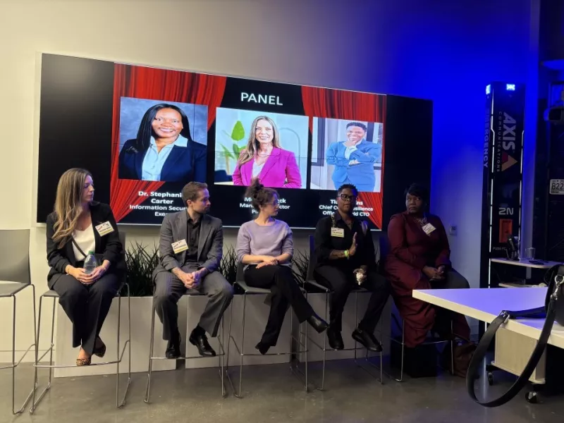 Panelists speaking at the ASIS Mixer hosted at the Atlanta Axis Experience Center in Atlanta.