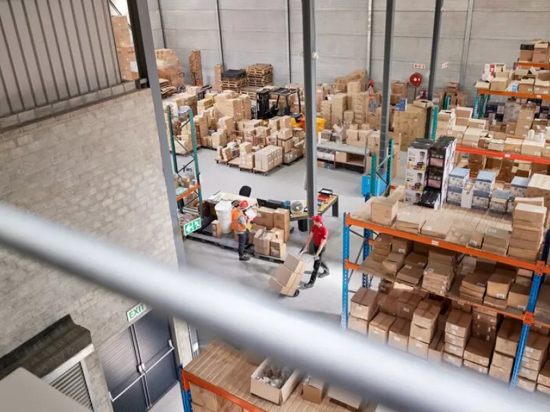 Overview of distribution center were people are loading parcels.