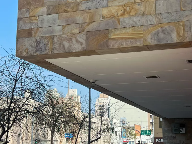 Shot of camera on eave of Distrito Capitalinas