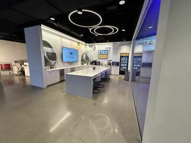 Minneapolis Axis Experience Center Fika Café offering a comfortable space for visitors to relax while exploring advanced security solutions and technology demonstrations.