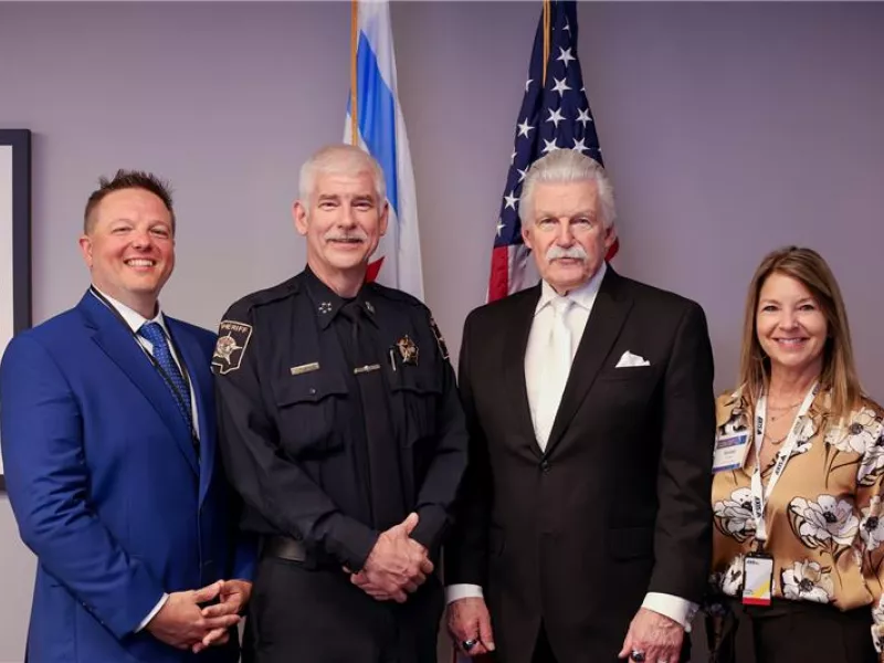 Guest speakers Jim Mendrick, Sheriff of DuPage County, and Jim Glasgow, Will County States Attorney, presenting at the Securing Tomorrow event focused on advanced security solutions and best practices.