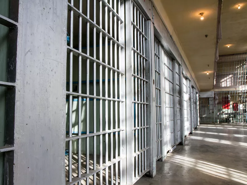 prison corridor cells steel concrete floor