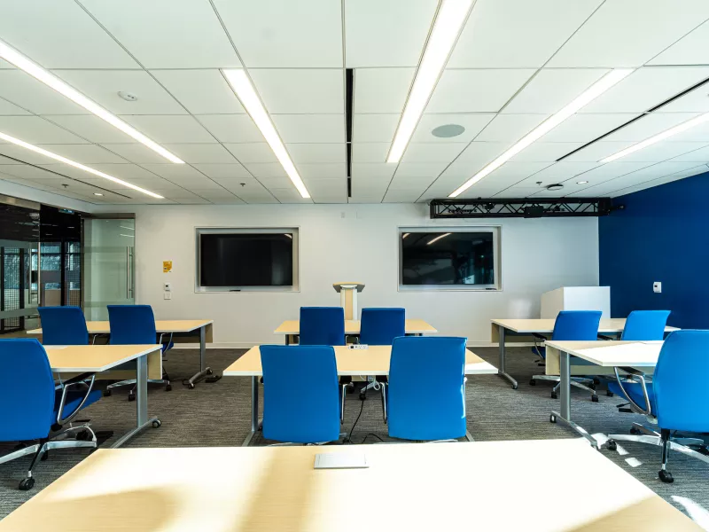 Training and meeting spaces at the Vancouver Axis Experience Center, accommodating both small and large groups.