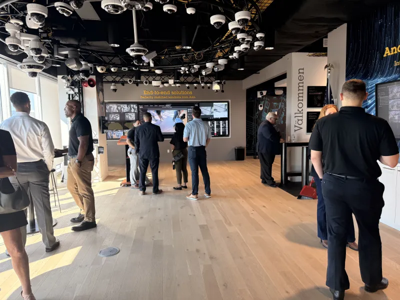 Attendees networking during the Risk to Resilience: Safety in Healthcare Greater Houston IAHSS happy hour at the Houston Axis Experience Center