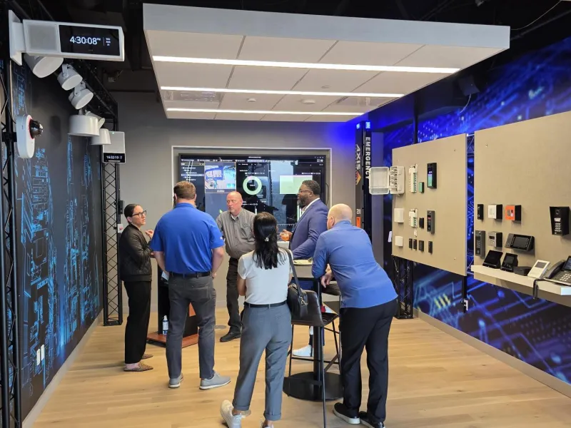 Guests attending the Simplify & Amplify: Audio integration partner happy hour Houston at the Houston Axis Experience Center